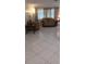 Comfortable living room featuring tiled floors, sofas, and ambient lighting at 10928 Tangora St, Orlando, FL 32825