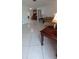 Spacious living room with tile flooring, a built-in hutch and access to additional spaces at 10928 Tangora St, Orlando, FL 32825