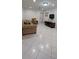 Comfortable living room with tile flooring, couch, chair, and mounted television at 10928 Tangora St, Orlando, FL 32825