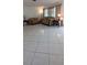 Comfortable living room with neutral tile flooring and matching sofas at 10928 Tangora St, Orlando, FL 32825