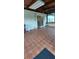 Enclosed patio with patterned tile flooring, ceiling fan, and sliding glass doors leading indoors, perfect for relaxing or entertaining at 10928 Tangora St, Orlando, FL 32825