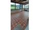 Spacious covered patio with tile flooring and a gated entryway for added security at 10928 Tangora St, Orlando, FL 32825