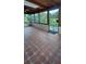 Covered patio featuring tile flooring and a secure gated entryway to the yard at 10928 Tangora St, Orlando, FL 32825