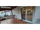 Spacious screened patio features tile flooring, ceiling fan, and sliding door entry to the home's interior at 10928 Tangora St, Orlando, FL 32825