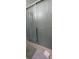 Bathroom shower stall with sliding glass doors and light gray tile at 10928 Tangora St, Orlando, FL 32825