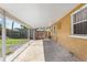 Spacious covered parking area with views of a fenced backyard and well-maintained lawn at 1104 W Marjorie St, Lakeland, FL 33815