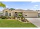 Charming single-story home with well-manicured lawn and lush landscaping in a desirable community at 1254 Spartanburg Way, The Villages, FL 32162