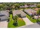 Well-maintained home with a manicured lawn, palm trees and beautiful landscaping at 1254 Spartanburg Way, The Villages, FL 32162