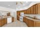 Well-equipped kitchen with ample cabinets, countertops, and modern appliances for cooking at 1254 Spartanburg Way, The Villages, FL 32162