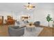 Open concept living room with an adjacent dining area, perfect for entertaining guests at 1254 Spartanburg Way, The Villages, FL 32162
