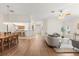 Spacious living space featuring open floor plan with living room, dining area, and kitchen at 1254 Spartanburg Way, The Villages, FL 32162