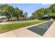 A shuffleboard court with clear markings and manicured lawn at a community amenity at 1254 Spartanburg Way, The Villages, FL 32162