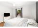Light-filled bedroom with a ceiling fan, a television on a dresser, and a window with curtains at 131 N Central Ave, Apopka, FL 32703