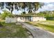 Traditional single-story home featuring a front-facing garage and classic ranch architecture at 131 N Central Ave, Apopka, FL 32703