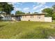 Classic single-story home with a well-maintained lawn and subtle landscaping at 131 N Central Ave, Apopka, FL 32703
