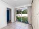 Bright interior space with tiled flooring, sliding glass doors to the backyard, and neutral walls at 131 N Central Ave, Apopka, FL 32703