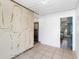 Transitional area with tile flooring that leads into the kitchen and bedroom at 131 N Central Ave, Apopka, FL 32703