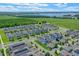 Residential area featuring modern homes with solar panels near a scenic lake at 1378 Roxy Ln, Winter Garden, FL 34787