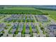 Neighborhood aerial shot featuring manicured lawns, solar panels, and tree-lined streets at 1378 Roxy Ln, Winter Garden, FL 34787