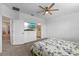 Bright bedroom with a TV and a view into the bathroom at 1378 Roxy Ln, Winter Garden, FL 34787