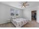 Bright bedroom with ceiling fan, closet, and butterfly print bedding at 1378 Roxy Ln, Winter Garden, FL 34787