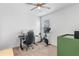 Home office with a desk, a chair, a Peloton and a window at 1378 Roxy Ln, Winter Garden, FL 34787