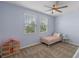 Bright bedroom with ceiling fan and two large windows at 1378 Roxy Ln, Winter Garden, FL 34787