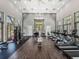 Well-equipped gym with modern equipment and lots of natural light at 1378 Roxy Ln, Winter Garden, FL 34787
