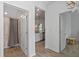 Bright hallway with a full bathroom and kitchen, offering convenience and functionality at 1378 Roxy Ln, Winter Garden, FL 34787