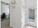 Open hallway leading to an office, an exterior door, and closet at 1378 Roxy Ln, Winter Garden, FL 34787