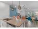 Spacious kitchen with large island, modern pendant lighting, and stainless steel appliances at 1378 Roxy Ln, Winter Garden, FL 34787