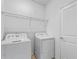 Bright laundry room with white washer and dryer at 1378 Roxy Ln, Winter Garden, FL 34787