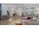 Bright living room featuring wood floors, neutral walls, and a comfortable gray sectional sofa at 1378 Roxy Ln, Winter Garden, FL 34787