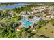 Aerial view of a resort style community pool with lush landscaping and nearby residences at 1378 Roxy Ln, Winter Garden, FL 34787