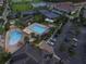 Wonderful aerial view of community amenities including tennis courts, swimming pools, playground and ample parking at 14164 Swanley St, Orlando, FL 32832