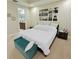 Bedroom with a large bed, dark furniture, and an attached bathroom at 14164 Swanley St, Orlando, FL 32832