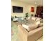 Comfortable living area featuring neutral tones, a stylish rug, and a large television for entertainment at 14164 Swanley St, Orlando, FL 32832