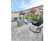 Outdoor patio area with a grill, hanging chair, and ample seating at 14164 Swanley St, Orlando, FL 32832