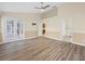 Open-concept living area with new floors, high ceilings, and easy access to other rooms at 14322 Pine Cone Trl, Clermont, FL 34711