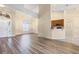 Open-concept area with wood floors, large window, and breakfast bar at 14322 Pine Cone Trl, Clermont, FL 34711