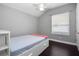 A cozy bedroom with a large window allowing natural light at 1441 Foxtail Ct, Lake Mary, FL 32746