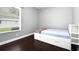 A cozy bedroom with a large window allowing natural light at 1441 Foxtail Ct, Lake Mary, FL 32746