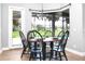 Bright breakfast nook with large windows offering views of the outdoors, adjacent to the kitchen at 1441 Foxtail Ct, Lake Mary, FL 32746
