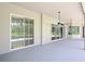 Covered patio with ceiling fans, offering a view of the backyard at 1441 Foxtail Ct, Lake Mary, FL 32746