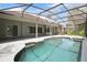 Relaxing pool area with screened enclosure and covered patio with ceiling fans at 1441 Foxtail Ct, Lake Mary, FL 32746