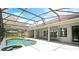 Relaxing pool area with screened enclosure and covered patio at 1441 Foxtail Ct, Lake Mary, FL 32746