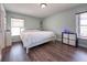 Cozy bedroom featuring hardwood floors, natural light, and simple, elegant decor at 1470 Daniels Cove Dr, Winter Garden, FL 34787