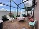 Enclosed patio featuring a red brick floor and outdoor seating at 1470 Daniels Cove Dr, Winter Garden, FL 34787