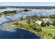 Aerial view showcasing a community pool with lake in the background at 15500 Fountain Cove Ct, Winter Garden, FL 34787