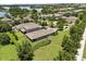 Aerial shot of homes with spacious backyards, lush greenery, and tree-lined streets in a beautiful neighborhood at 15500 Fountain Cove Ct, Winter Garden, FL 34787